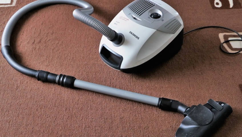 A vacuum cleaner on a carpet